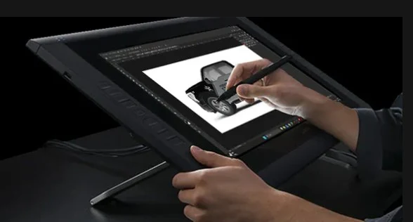 Designer creating apparel artwork on a drawing tablet